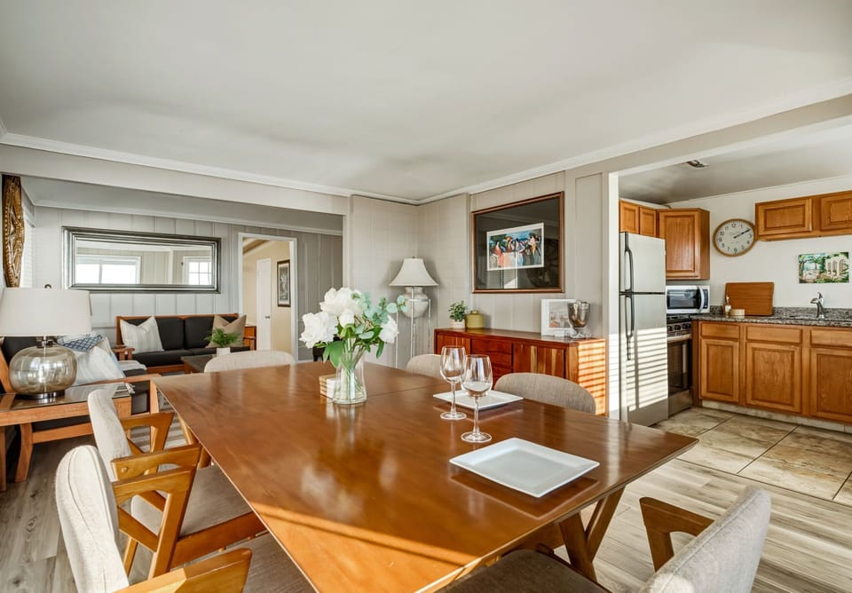 A thoughtfully laid-out space where dining, living, and kitchen areas flow together, making it easy to gather, connect, and feel at home by the coast.