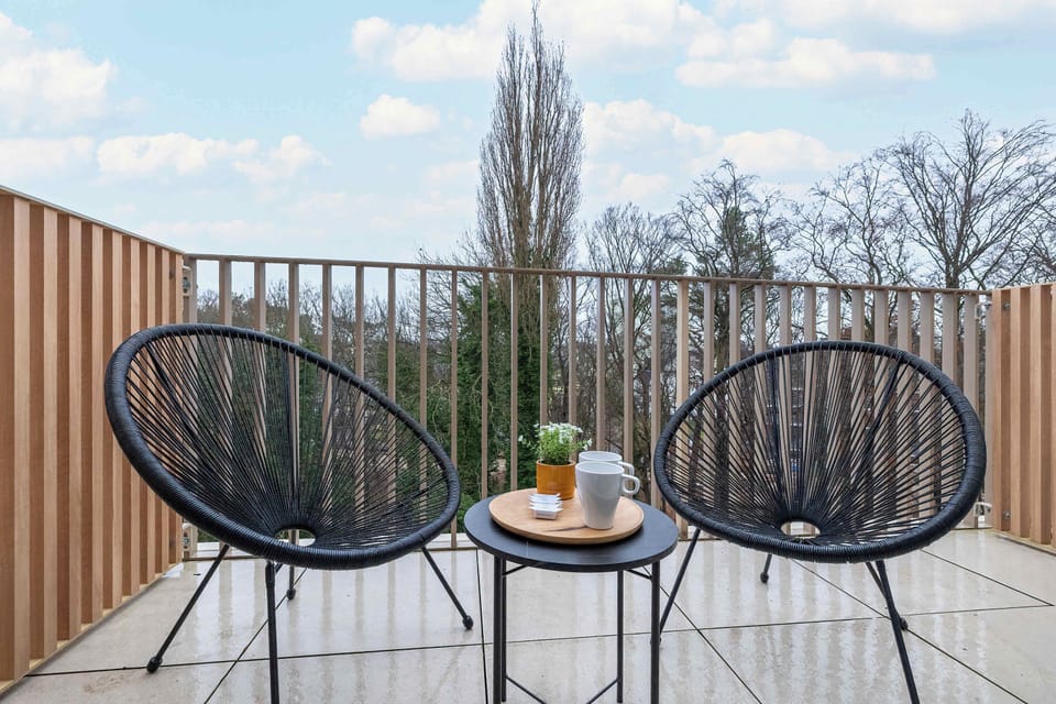 The balcony provides a serene environment for relaxation.