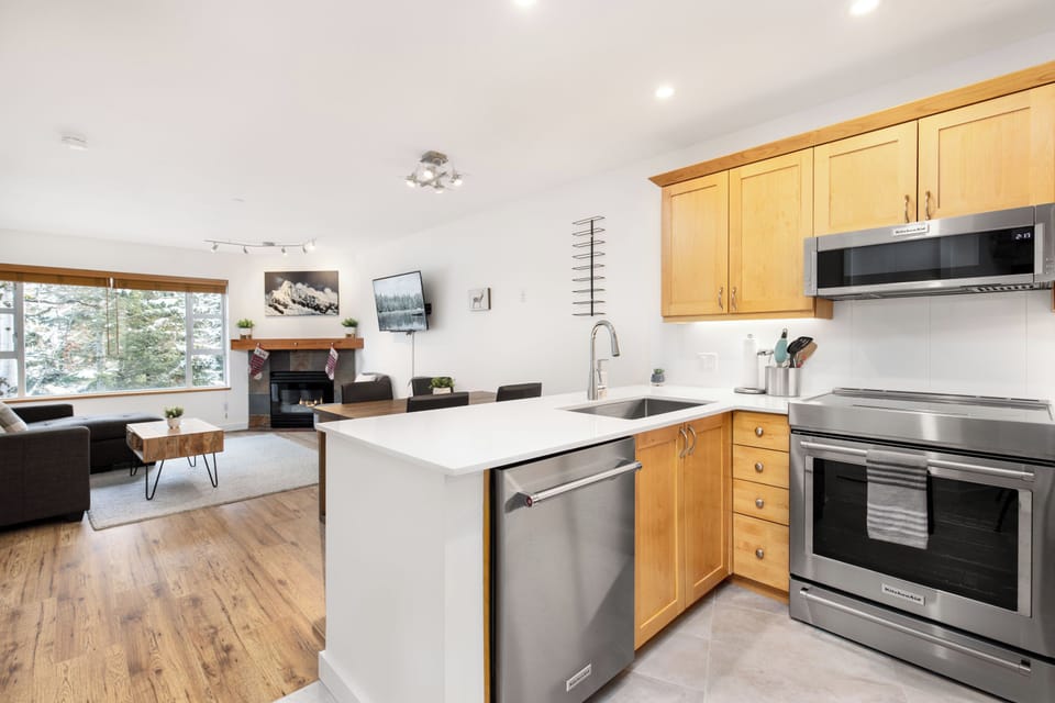 Kitchen Featuring Induction Range, Oven, Refrigerator, Microwave and Dishwasher
