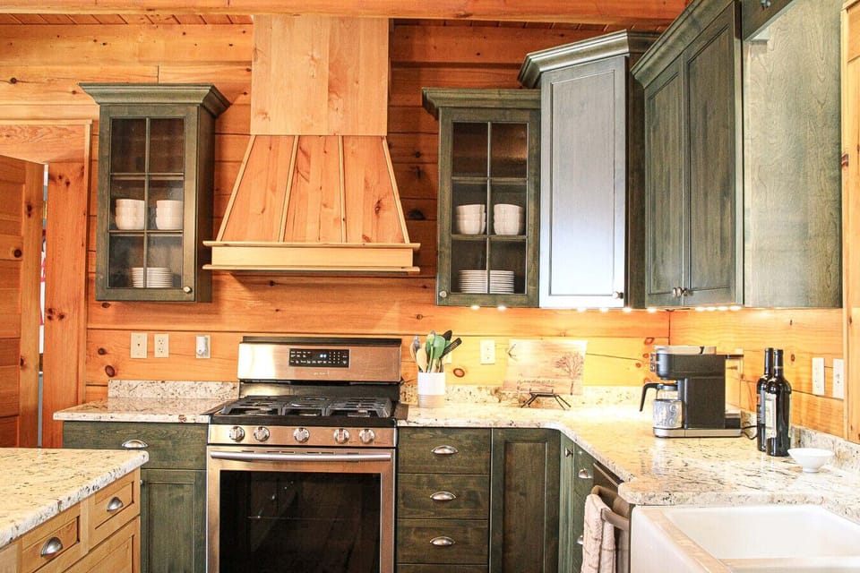 Cook with ease in our Lewisburg, WV cabin—full kitchen with granite counters, gas range, and a coffee station for Greenbrier Valley mornings