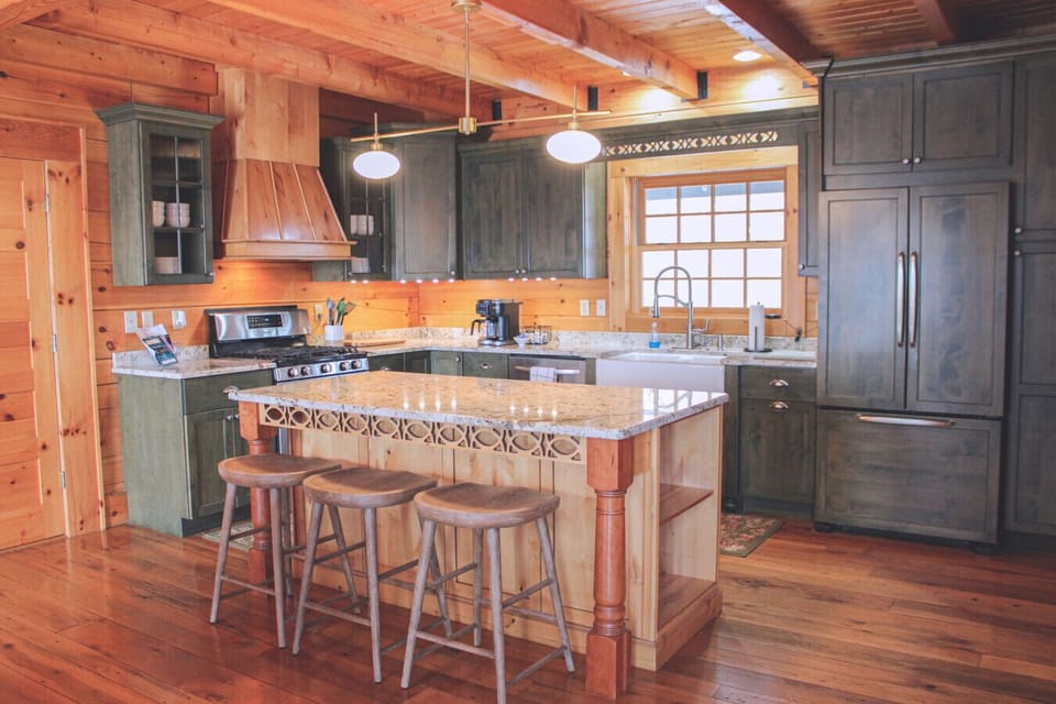 Gather at the island—easy breakfast bar seating for your Lewisburg / Greenbrier Valley cabin getaway