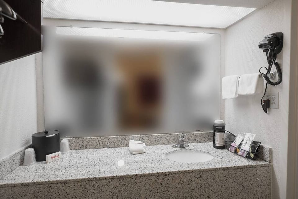 Prep comfortably at the well-lit sink with handy in-room essentials.
