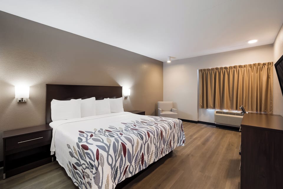 Unwind in a bright room with crisp linens and space.