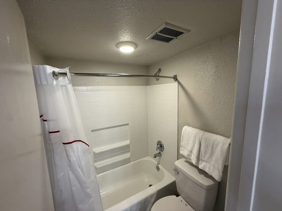 Freshen up easily with a clean tub shower and bright light.
