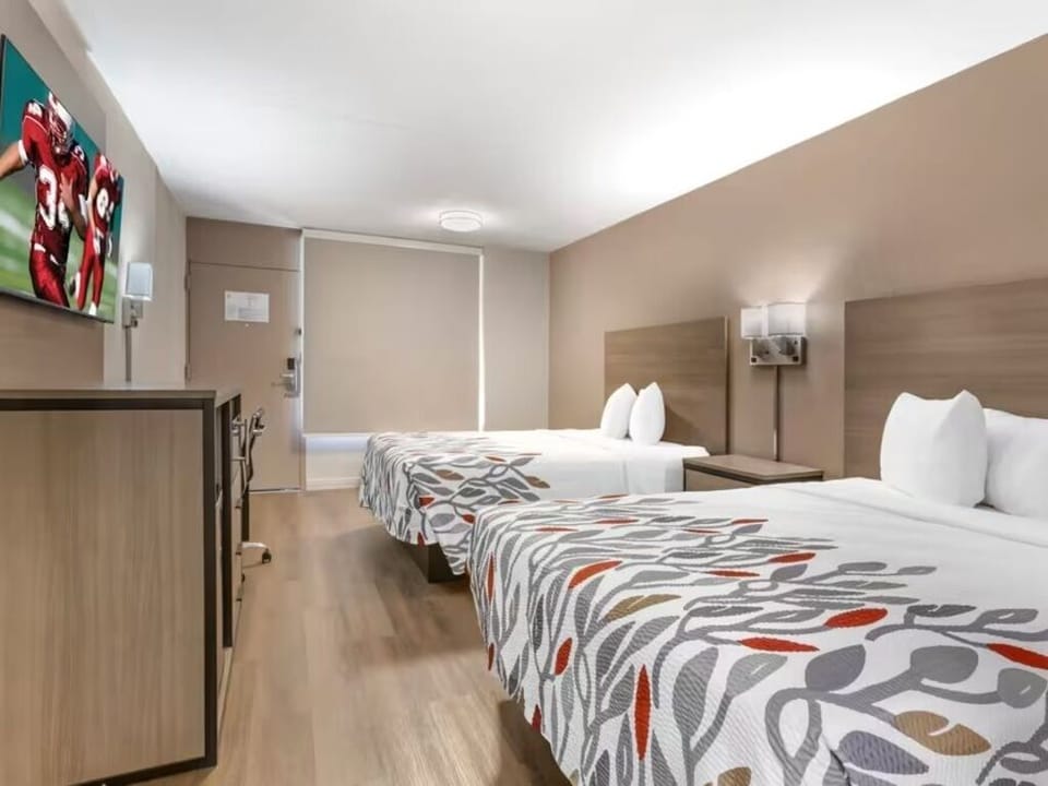 Stretch out on two cozy beds in a spacious room.