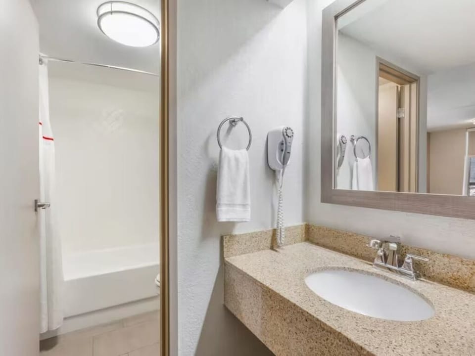 Refresh easily with a bright vanity and clean shower.
