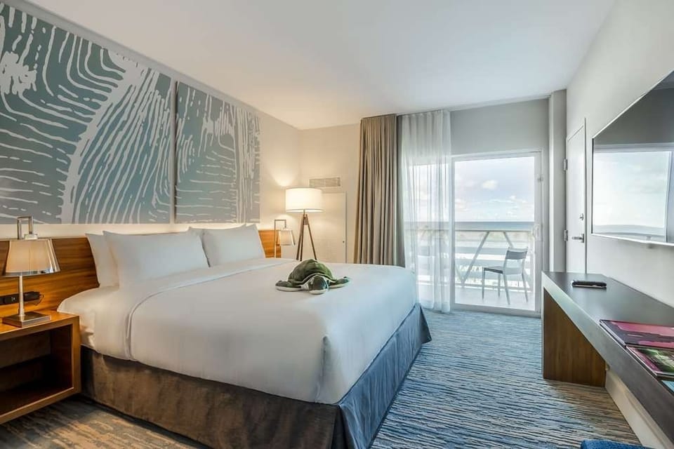 Sink into crisp linens and drift off beside ocean views.