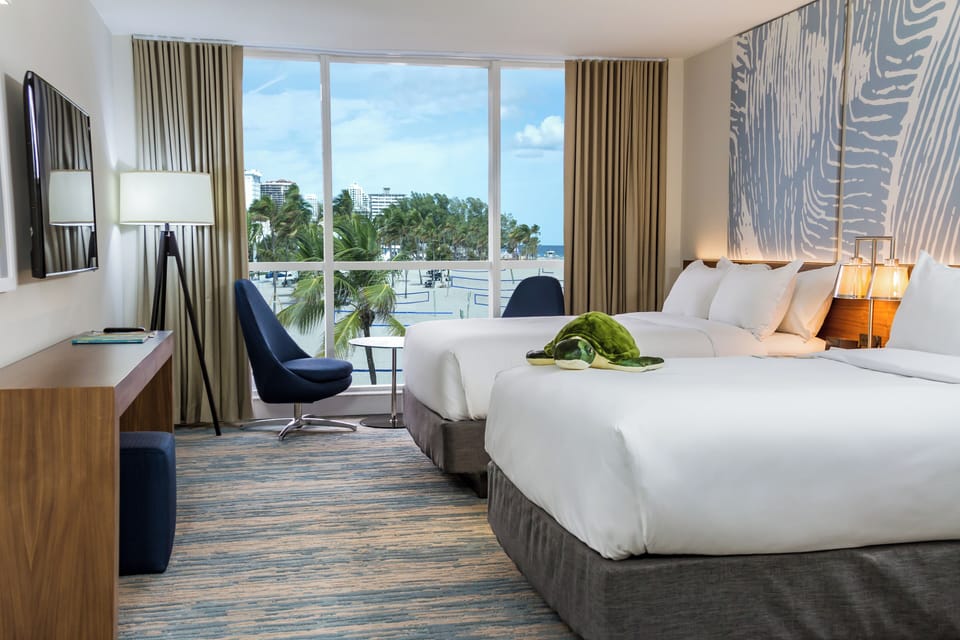 Drift off with beach views and calm, coastal design.