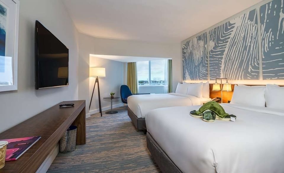 Settle in with a roomy layout, large TV, and calm tones.