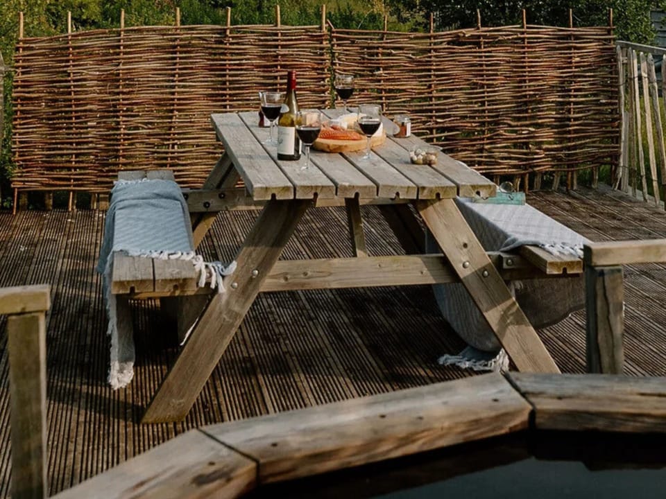 Outdoor private decking with dining table and private hot tub