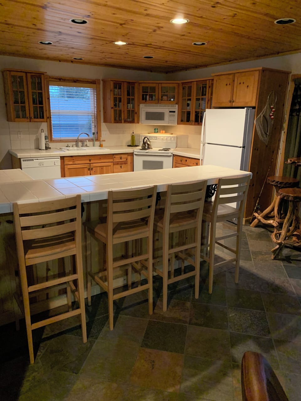 Full kitchen with eat in bar seating