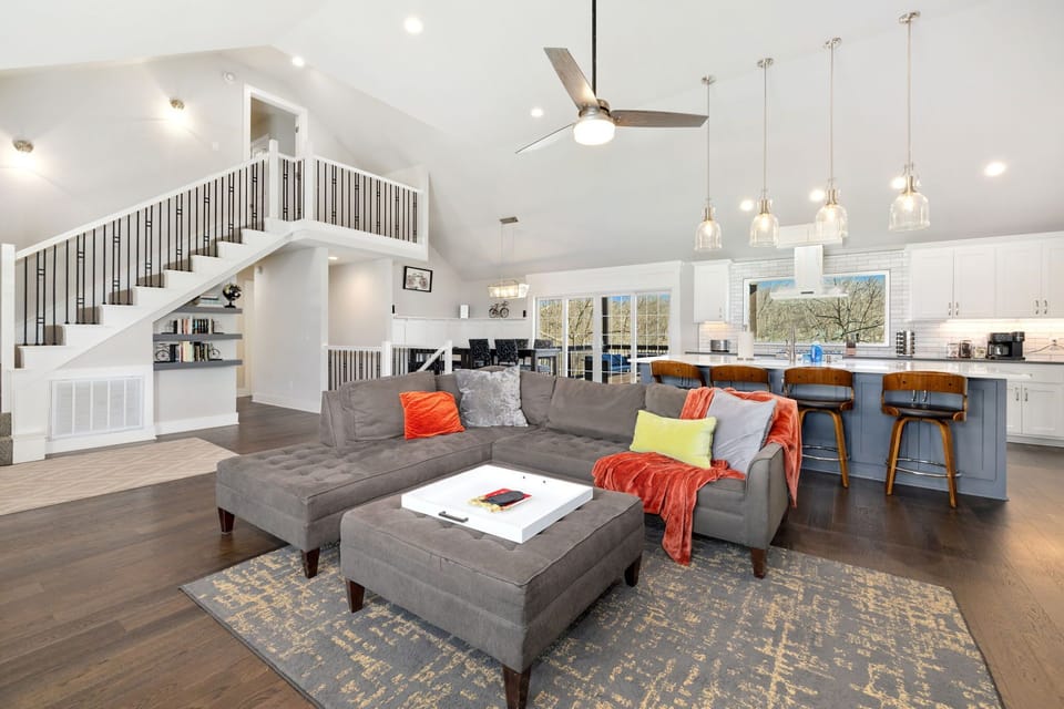 The living room has seating, a gas fireplace, and access to the patio! 