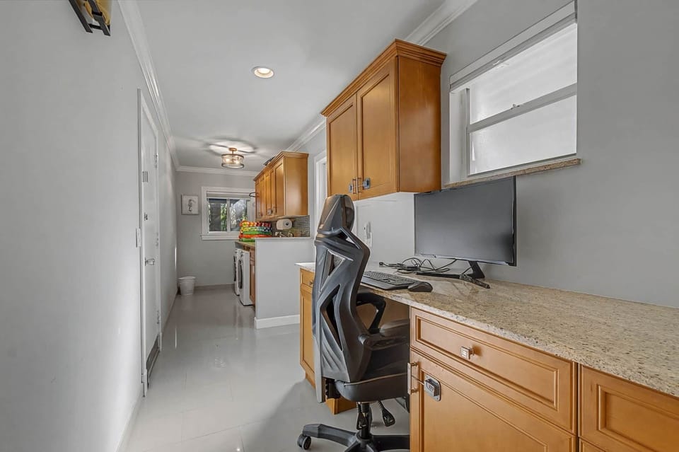Attached to first floor master bed is an office space and laundry