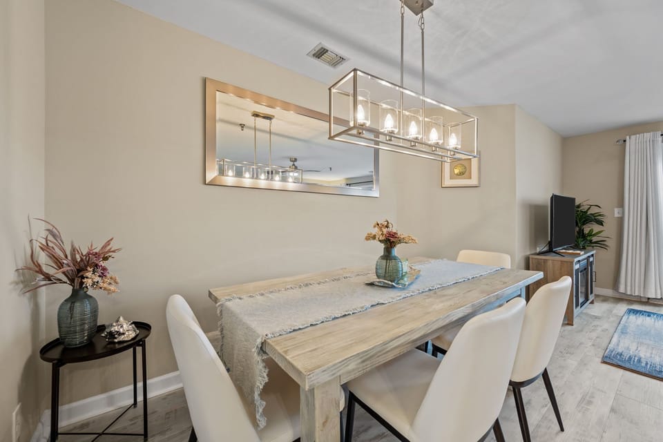 Enjoy home-cooked meals in this inviting dining area with chic décor