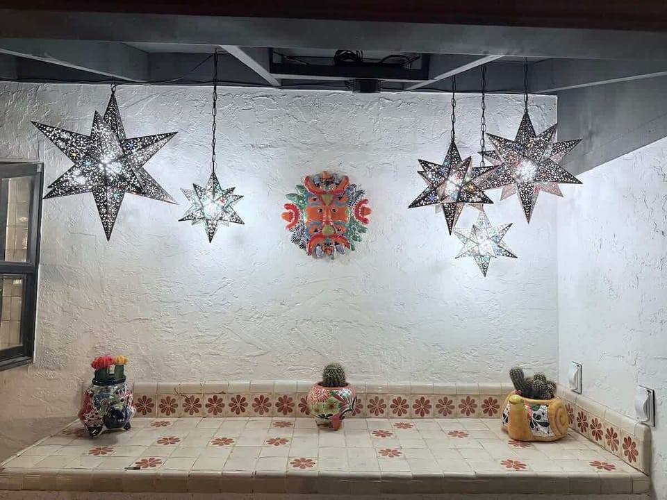 Meet the Instagram Wall. ✨ Stunning moravian star lanterns, hand-painted tile countertop, and unique Talavera accents. The perfect backdrop for your best selfie. Get your light right and smile for the camera!