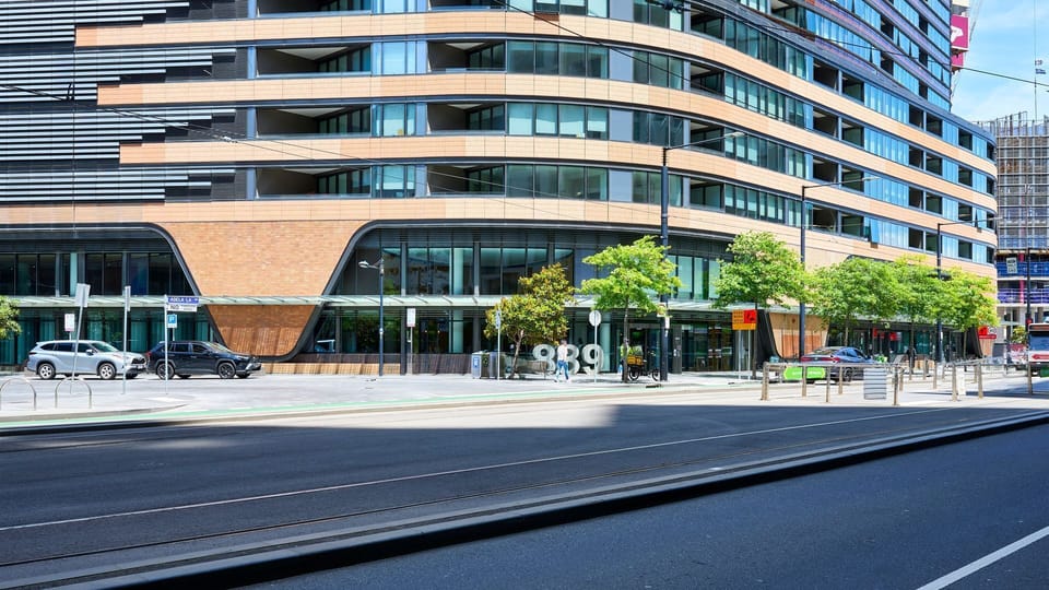 Contemporary building exterior showcasing sleek curves and urban design.