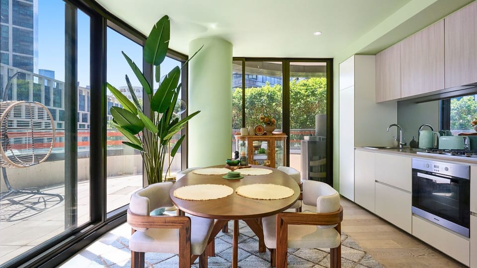 Light-filled dining area overlooking greenery for relaxed meals.