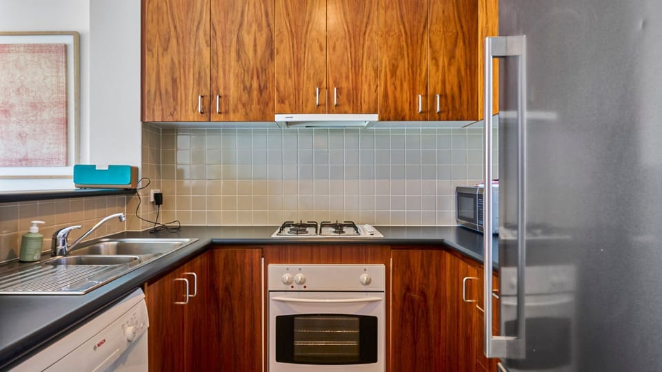 Fully equipped kitchen with gas cooking and ample storage