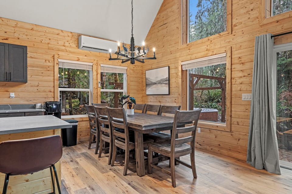 Large dining table and island with seating for up to 11 for large family meals.