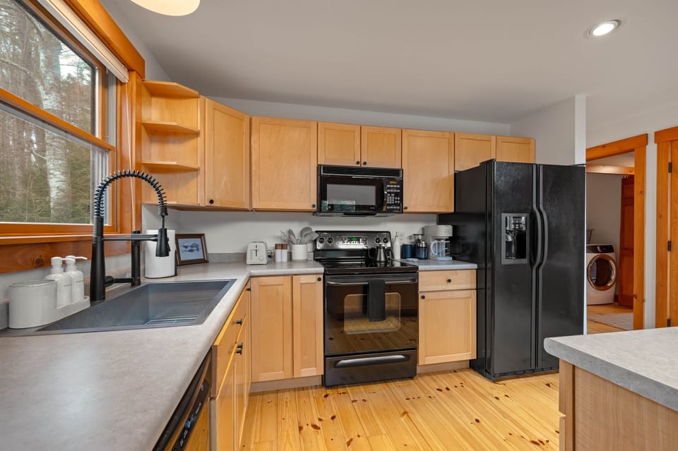[First Floor, Kitchen] All the essentials, and then some. You'll have access to an air fryer, waffle maker, bakeware, and more!