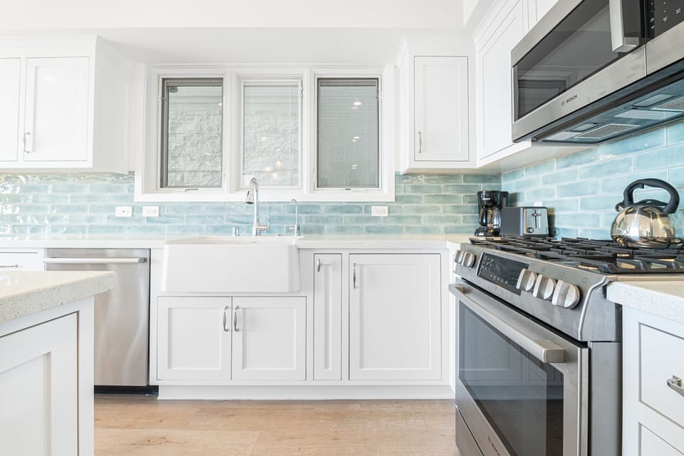 Crisp white cabinetry, premium appliances, and refined finishes, this kitchen invites you to slow down and savor every meal
                
