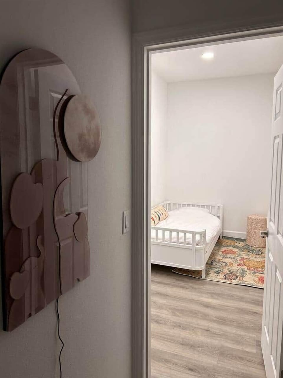 Downstairs queen bedroom with additional crib + twin bed and ensuite bathroom 