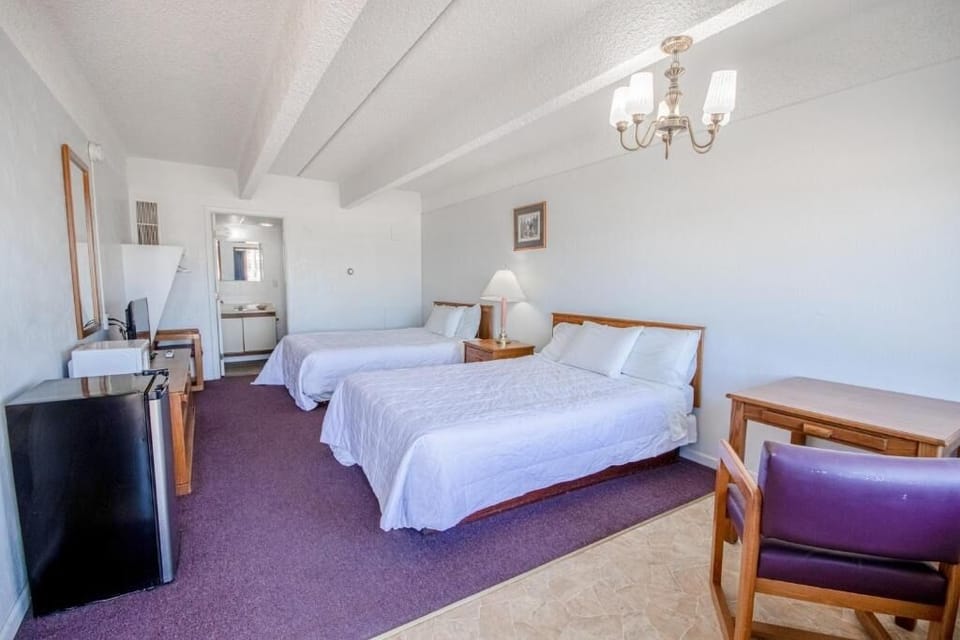 Unwind in a bright room with two comfortable beds.