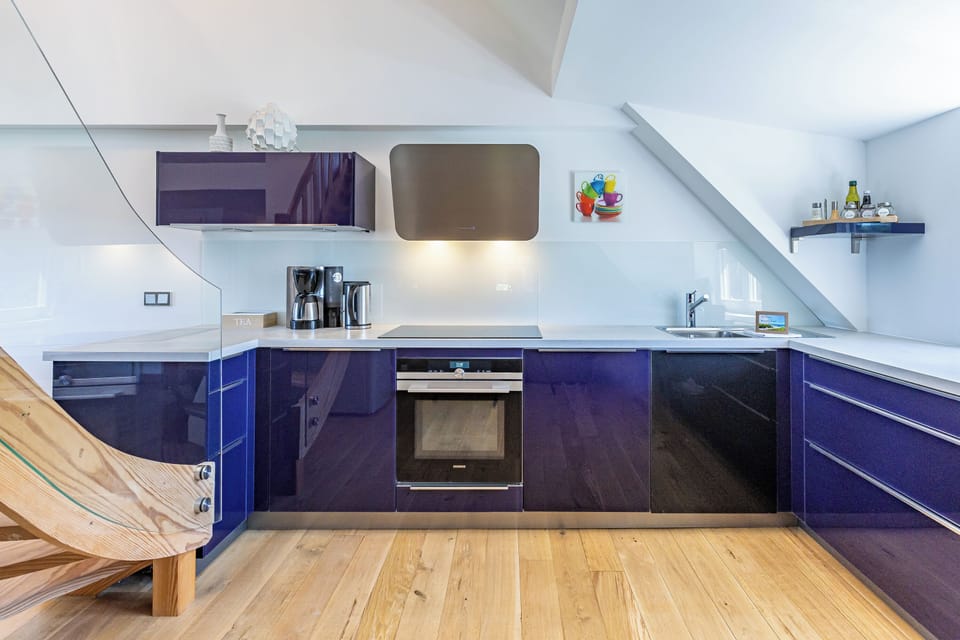 Modern Kitchen with Blue Cabinets and Wooden Floor