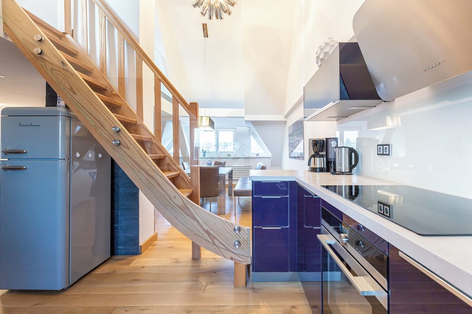 Modern Kitchen with Wooden Stairs and Appliances