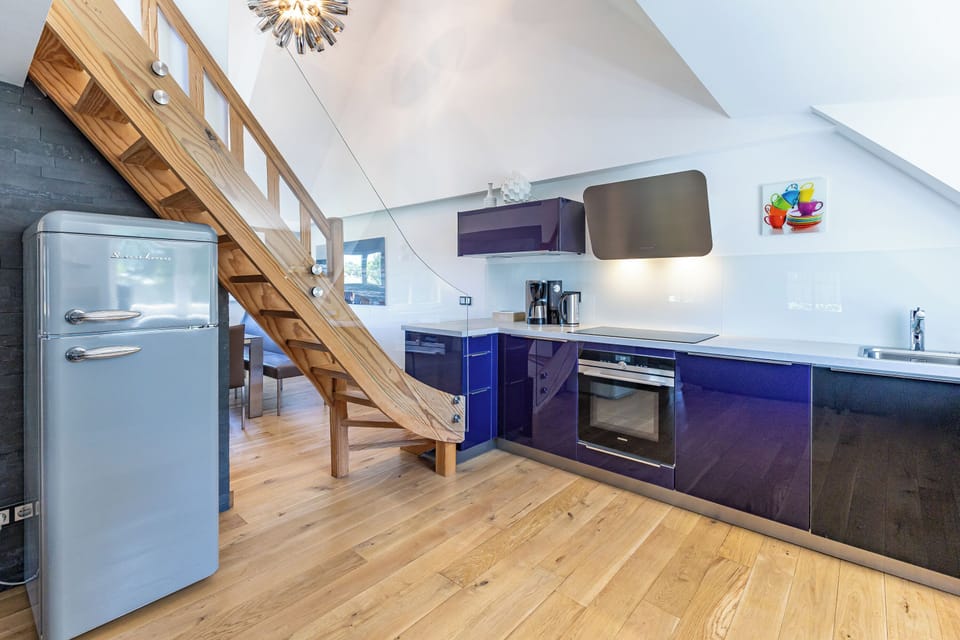 Modern Kitchen with Wooden Staircase