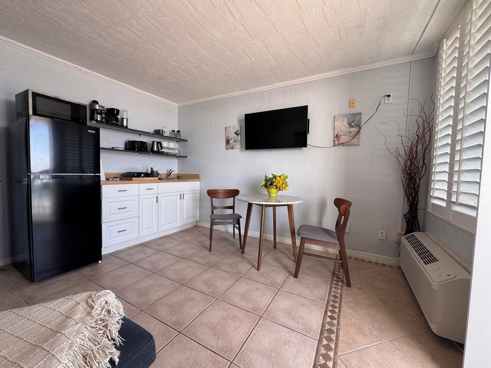 kitchenette with a cute little eating area if you don't want to eat on the balcony.