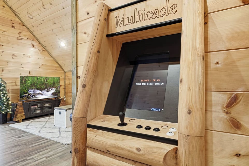 Challenge friends to classic arcade games in your rustic game room, complete with authentic wood finishes and cozy mountain charm.