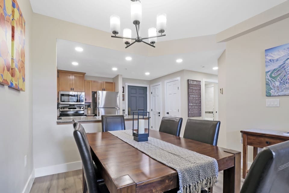 Gather around your spacious dining table for memorable meals, with the fully-equipped kitchen just steps away for easy entertaining and family time.