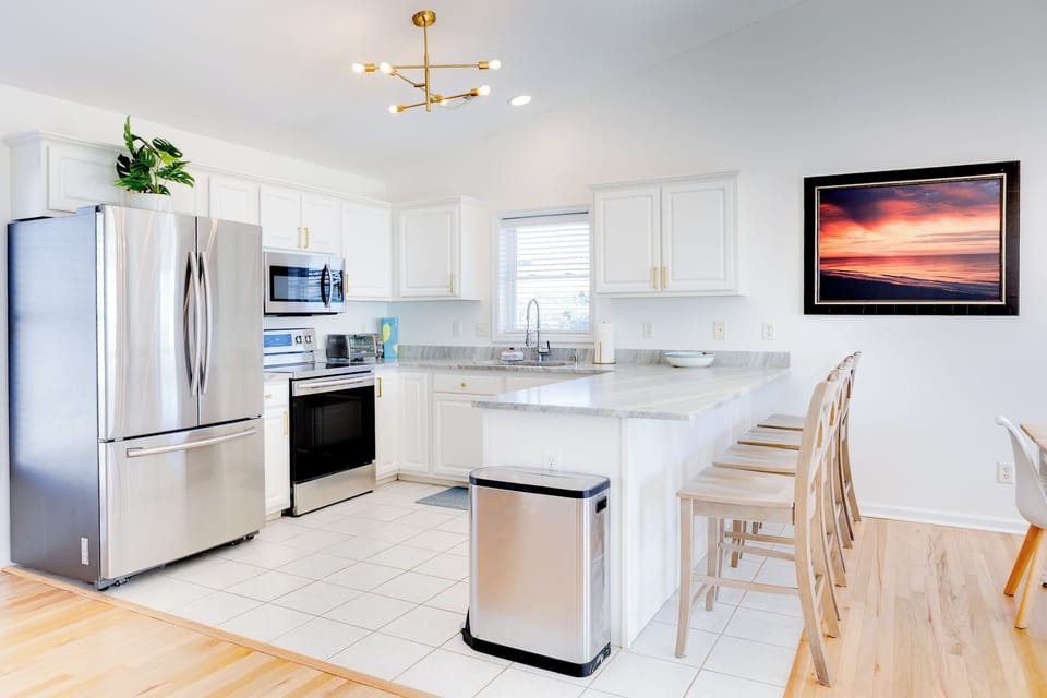 Bright, modern kitchen with a spacious island—perfect for cooking, gathering, and morning coffee!