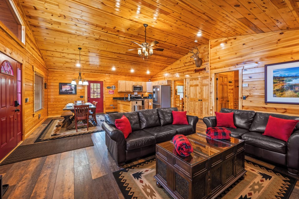 Open cabin living blends dining, lounge, and kitchen for cozy gatherings inside!