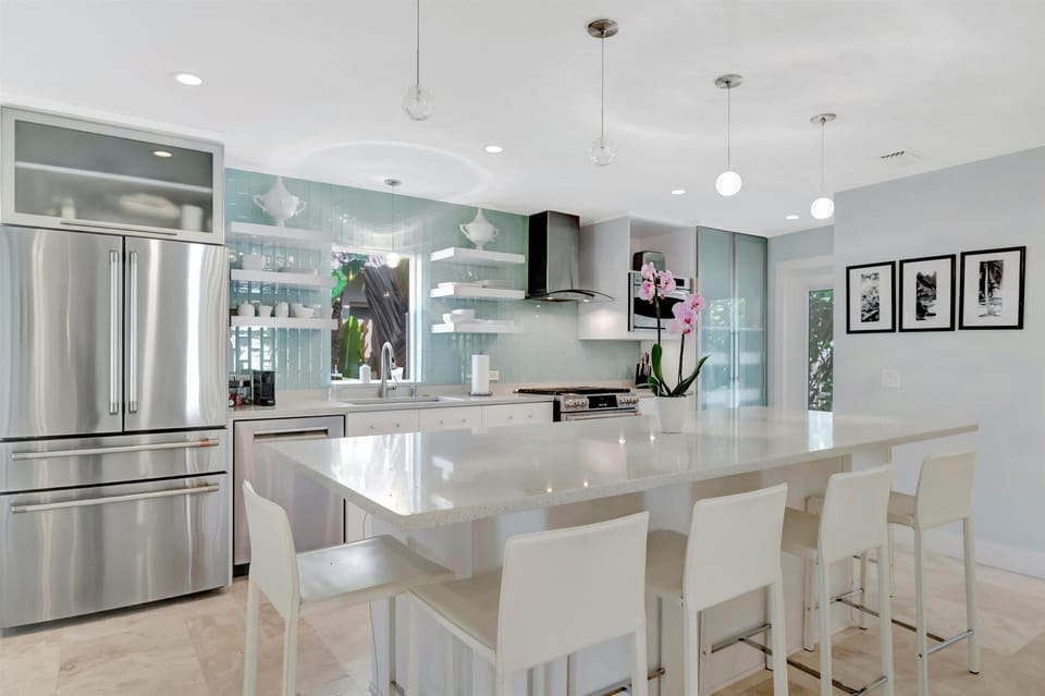 Open kitchen with ample counter space and bar seating