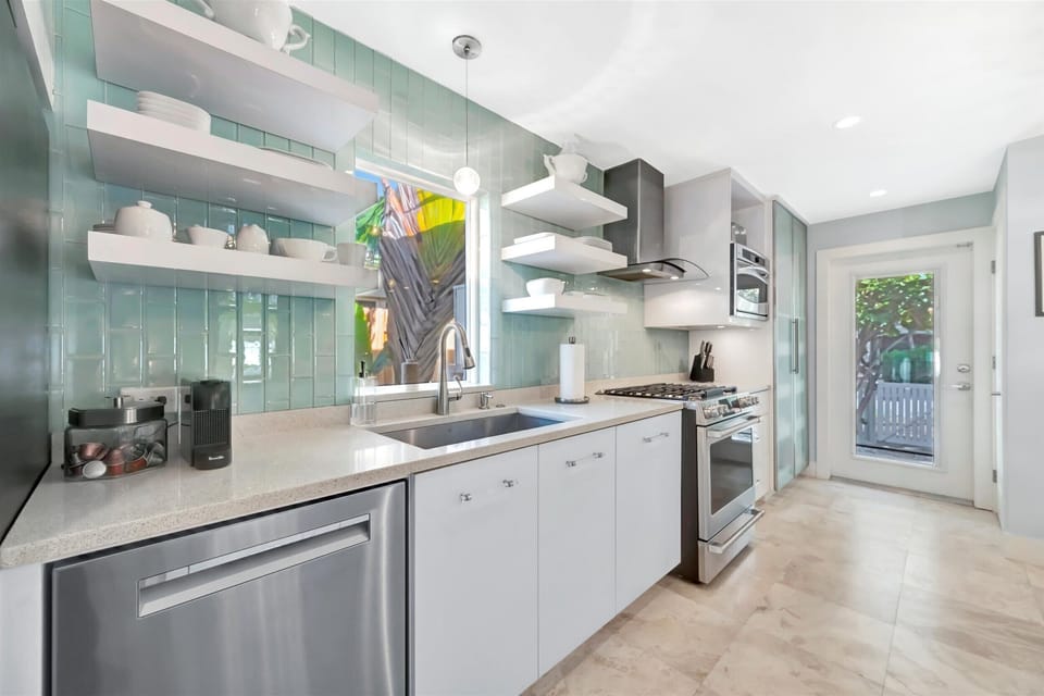 Fully equipped modern kitchen with stainless steel appliances