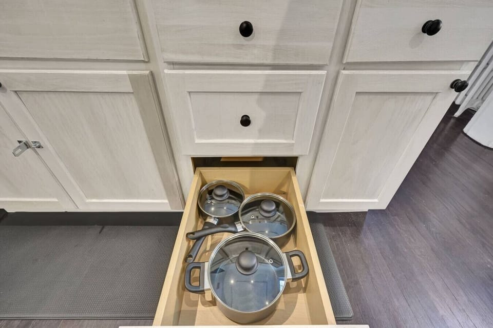 Fully equipped with the essentials for a seamless stay. This thoughtfully organized space ensures you have everything needed to prepare a home cooked meal or enjoy a quiet night in with total ease and convenience.