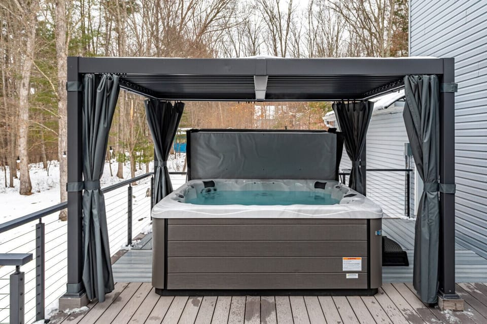 Private covered hot tub on the deck — perfect for year-round relaxation