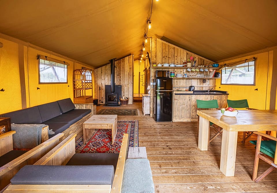 Spacious open-plan kitchen, dining and sitting area with a log burner