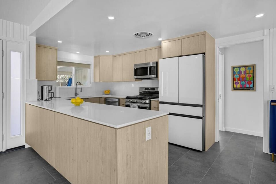 Spacious countertop perfect for meal prep. Refrigerator, oven, and microwave at your fingertips