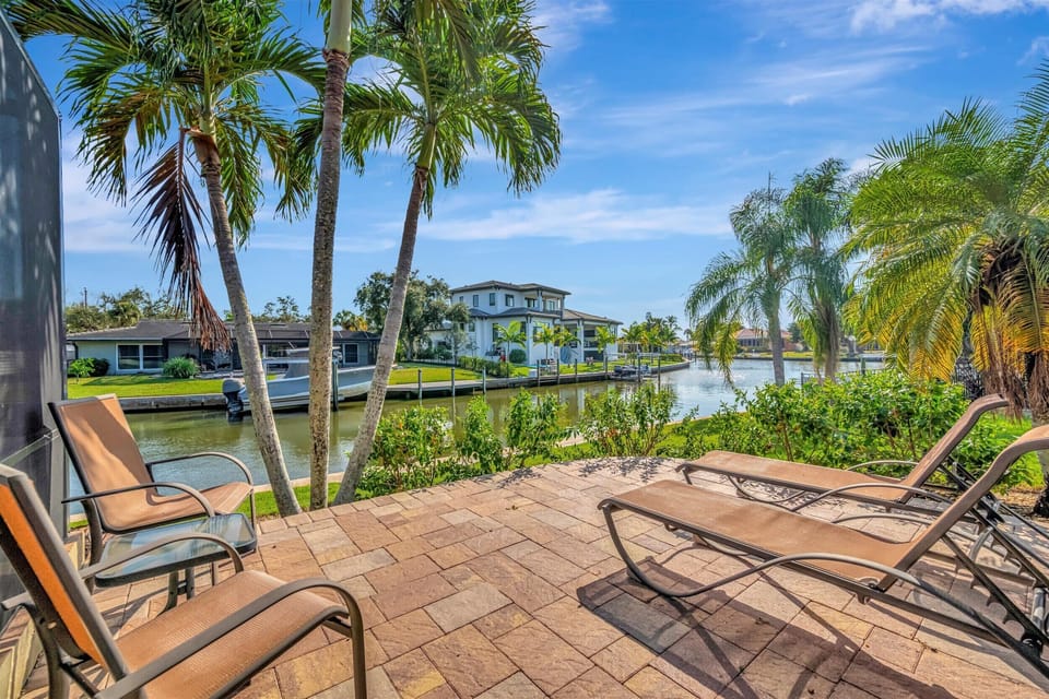 Tan right on the private patio waterfront