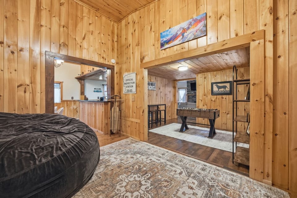 Spacious game room and lounge area near Gunstock Mountain, ideal for families and groups.
