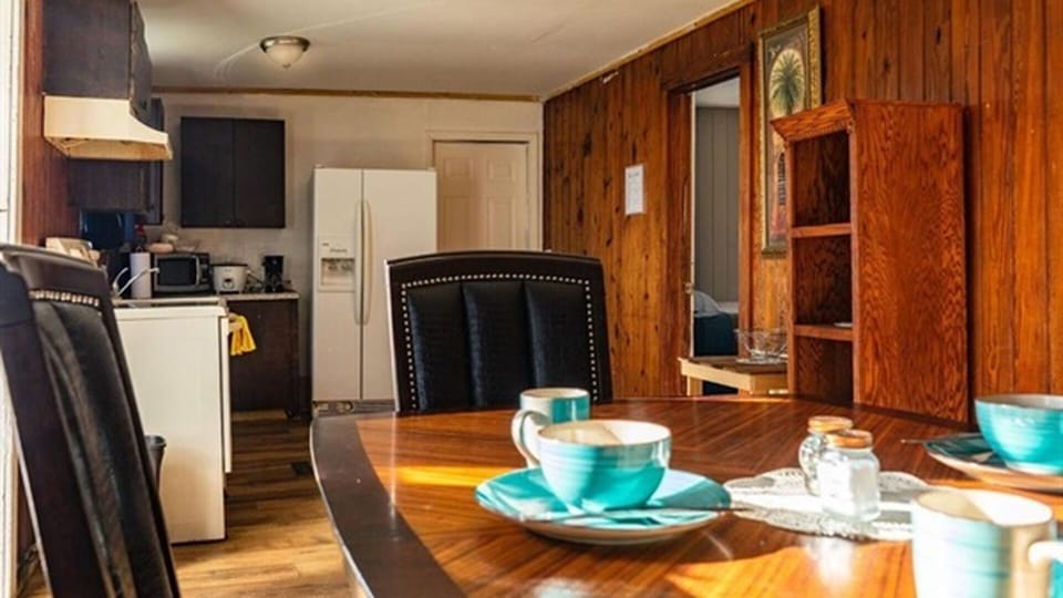 Dining area with kitchen access and table setup