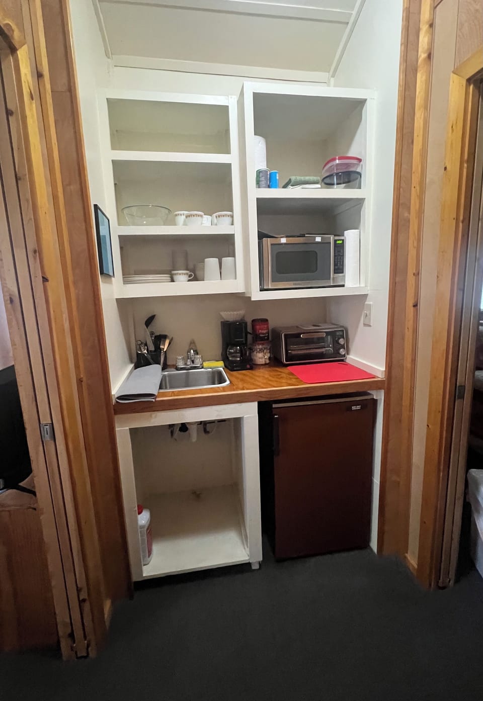Kitchenette with small fridge, coffeemaker, microwave, toaster oven/air fryer