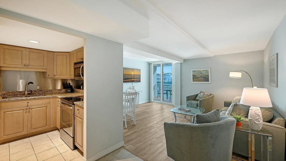 Cozy living room and kitchen with serene city views