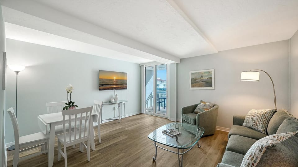 Bright and airy living room with cozy seating and city views