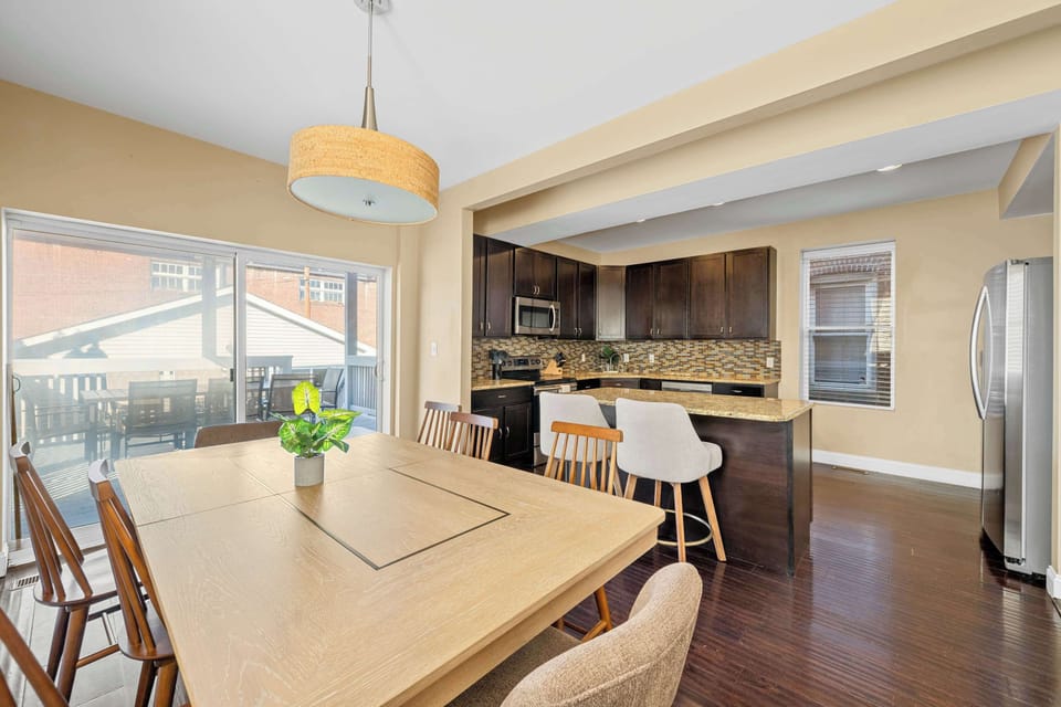 Cook, gather, and entertain with ease in this spacious kitchen featuring granite countertops, stainless steel appliances, and ample seating.