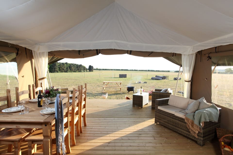 An open-plan living room with views over the fields, the perfect place to watch the sunset.