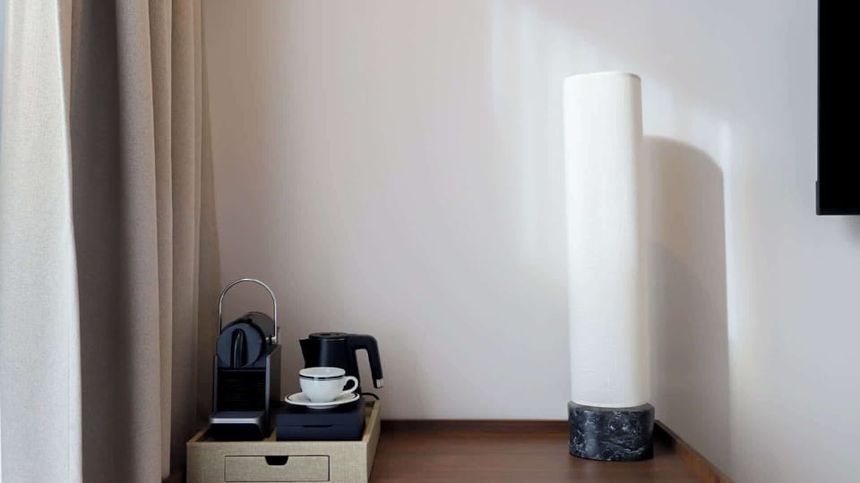 Enjoy your morning ritual with a Nespresso machine and tea set, all ready for use in your room.
